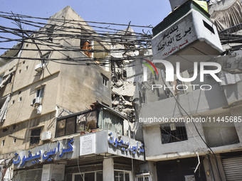 A view is showing a partially destroyed building, which is being targeted by the Israeli army, in Beirut, Lebanon, on July 31, 2024. The Isr...