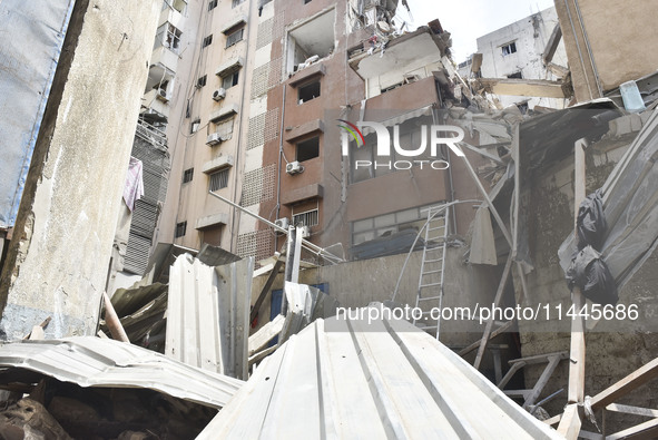 A view is showing a partially destroyed building, which is being targeted by the Israeli army, in Beirut, Lebanon, on July 31, 2024. The Isr...