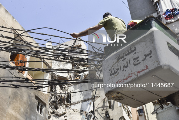 A view is showing a partially destroyed building, which is being targeted by the Israeli army, in Beirut, Lebanon, on July 31, 2024. The Isr...