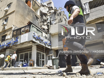 A view is showing a partially destroyed building, which is being targeted by the Israeli army, in Beirut, Lebanon, on July 31, 2024. The Isr...