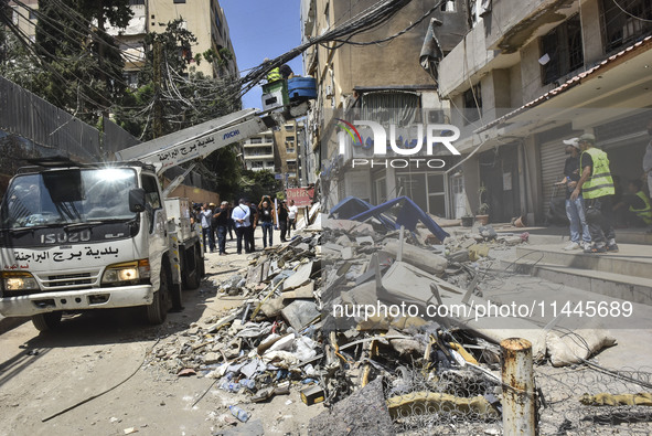 A view is showing a partially destroyed building, which is being targeted by the Israeli army, in Beirut, Lebanon, on July 31, 2024. The Isr...