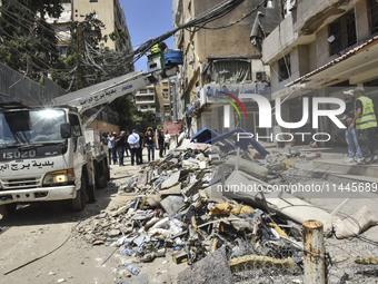 A view is showing a partially destroyed building, which is being targeted by the Israeli army, in Beirut, Lebanon, on July 31, 2024. The Isr...