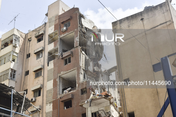 A view is showing a partially destroyed building, which is being targeted by the Israeli army, in Beirut, Lebanon, on July 31, 2024. The Isr...