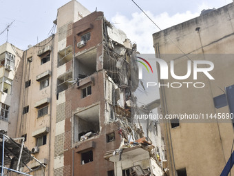 A view is showing a partially destroyed building, which is being targeted by the Israeli army, in Beirut, Lebanon, on July 31, 2024. The Isr...