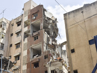 A view is showing a partially destroyed building, which is being targeted by the Israeli army, in Beirut, Lebanon, on July 31, 2024. The Isr...