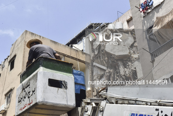 A view is showing a partially destroyed building, which is being targeted by the Israeli army, in Beirut, Lebanon, on July 31, 2024. The Isr...