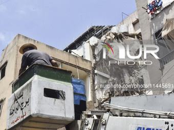 A view is showing a partially destroyed building, which is being targeted by the Israeli army, in Beirut, Lebanon, on July 31, 2024. The Isr...