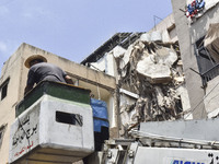 A view is showing a partially destroyed building, which is being targeted by the Israeli army, in Beirut, Lebanon, on July 31, 2024. The Isr...