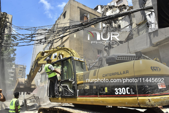 A view is showing a partially destroyed building, which is being targeted by the Israeli army, in Beirut, Lebanon, on July 31, 2024. The Isr...