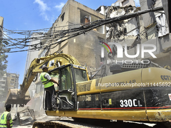 A view is showing a partially destroyed building, which is being targeted by the Israeli army, in Beirut, Lebanon, on July 31, 2024. The Isr...