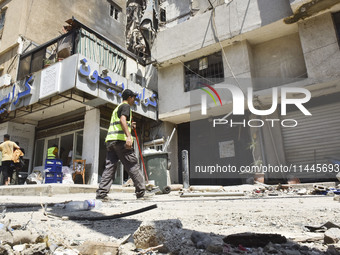 A view is showing a partially destroyed building, which is being targeted by the Israeli army, in Beirut, Lebanon, on July 31, 2024. The Isr...