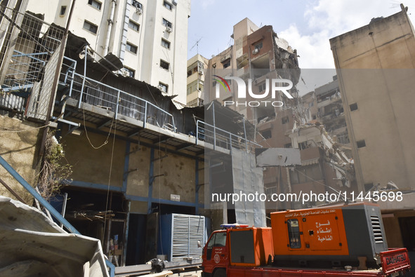 A view is showing a partially destroyed building, which is being targeted by the Israeli army, in Beirut, Lebanon, on July 31, 2024. The Isr...