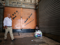 Vendors are closing their shops in the Old City of Jerusalem, Israel, on July 31, 2024, during a general strike following the news of the as...