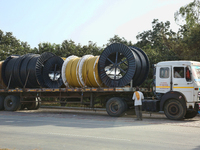 A truck is carrying large spools of pipe in Jaspur, Uttarakhand, India, on April 19, 2024. (