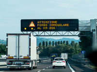 Mountain motorways between the nations of Italy, Austria, and Germany in July 2024 are showing illuminated signposts and car roads to Italy....