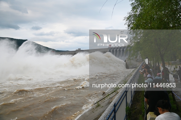 The Fengman Dam reservoir is opening the sluice to release floodwater in Jilin City, Jilin province, China, on July 31, 2024. 