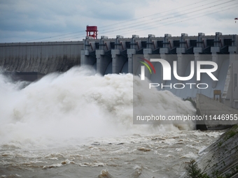 The Fengman Dam reservoir is opening the sluice to release floodwater in Jilin City, Jilin province, China, on July 31, 2024. (