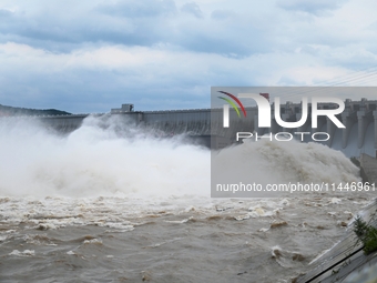 The Fengman Dam reservoir is opening the sluice to release floodwater in Jilin City, Jilin province, China, on July 31, 2024. (