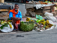 A man is selling fruits along the roadside in Thiruvananthapuram (Trivandrum), Kerala, India, on April 13, 2024. (