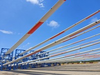 Blades of offshore wind turbines are waiting to be loaded at Penglai Port area of Yantai Port in Yantai, China, on July 31, 2024. On July 31...