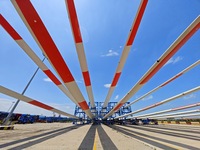 Blades of offshore wind turbines are waiting to be loaded at Penglai Port area of Yantai Port in Yantai, China, on July 31, 2024. On July 31...