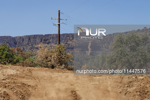 The aftermath from the Thompson Fire is being seen along Oregon Gulch Road, in Oroville, Calif., on July 28, 2024. Burning 3,789 acres in ea...