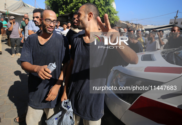 Men who are being detained by Israel during the military operation in Gaza are reacting after their release at the Aqsa Martyrs Hospital in...