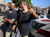 Men who are being detained by Israel during the military operation in Gaza are reacting after their release at the Aqsa Martyrs Hospital in...