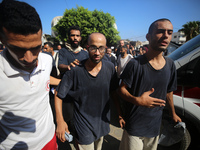 Men who are being detained by Israel during the military operation in Gaza are reacting after their release at the Aqsa Martyrs Hospital in...