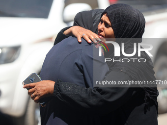 Palestinians are mourning over the bodies of loved ones  following Israeli bombardment in Deir el-Balah in the central Gaza Strip on August...