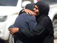 Palestinians are mourning over the bodies of loved ones  following Israeli bombardment in Deir el-Balah in the central Gaza Strip on August...