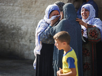 Palestinians are mourning over the bodies of loved ones  following Israeli bombardment in Deir el-Balah in the central Gaza Strip on August...