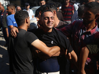 Palestinians are mourning over the bodies of loved ones  following Israeli bombardment in Deir el-Balah in the central Gaza Strip on August...