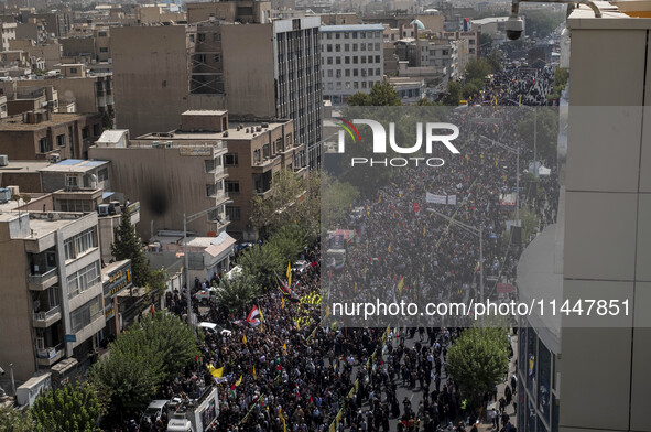 A truck carrying the coffins containing the bodies of Hamas leader Ismail Haniyeh and his bodyguard Abu Shaaban is making its way through th...