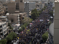 A truck carrying the coffins containing the bodies of Hamas leader Ismail Haniyeh and his bodyguard Abu Shaaban is making its way through th...