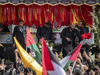 A truck is carrying the coffins containing the bodies of Hamas leader Ismail Haniyeh and his bodyguard Abu Shaaban during a funeral ceremony...