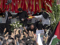 A truck is carrying the coffins containing the bodies of Hamas leader Ismail Haniyeh and his bodyguard Abu Shaaban during a funeral ceremony...