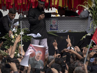 A truck is carrying the coffins containing the bodies of Hamas leader Ismail Haniyeh and his bodyguard Abu Shaaban during a funeral ceremony...