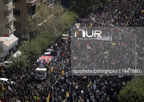 A truck carrying the coffins containing the bodies of Hamas leader Ismail Haniyeh and his bodyguard Abu Shaaban is making its way through th...