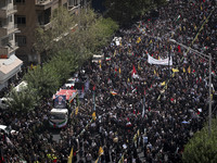 A truck carrying the coffins containing the bodies of Hamas leader Ismail Haniyeh and his bodyguard Abu Shaaban is making its way through th...