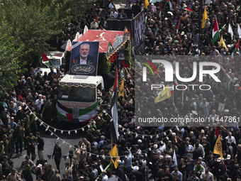 A truck carrying the coffins containing the bodies of Hamas leader Ismail Haniyeh and his bodyguard Abu Shaaban is making its way through th...