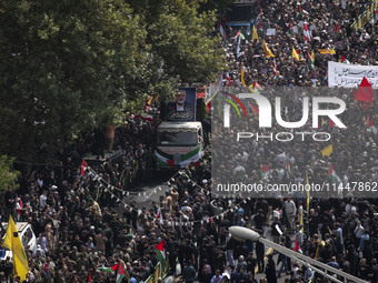 A truck carrying the coffins containing the bodies of Hamas leader Ismail Haniyeh and his bodyguard Abu Shaaban is making its way through th...