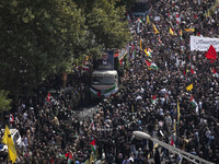 A truck carrying the coffins containing the bodies of Hamas leader Ismail Haniyeh and his bodyguard Abu Shaaban is making its way through th...