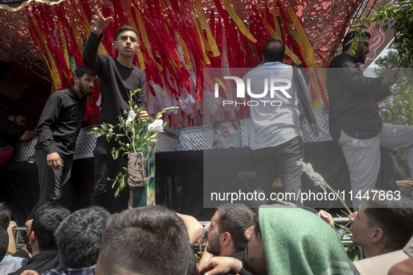 A truck is carrying the coffins containing the bodies of Hamas leader Ismail Haniyeh and his bodyguard Abu Shaaban during a funeral ceremony...