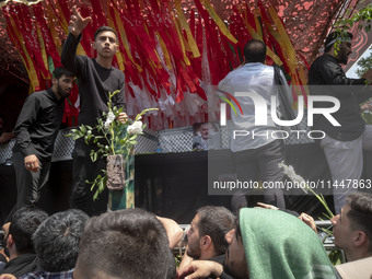 A truck is carrying the coffins containing the bodies of Hamas leader Ismail Haniyeh and his bodyguard Abu Shaaban during a funeral ceremony...