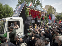 A truck is carrying the coffins containing the bodies of Hamas leader Ismail Haniyeh and his bodyguard Abu Shaaban during a funeral ceremony...