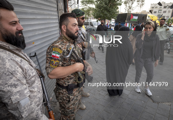 The Islamic Revolutionary Guard Corps (IRGC) armed special forces are monitoring an area during a funeral ceremony for Hamas leader Ismail H...