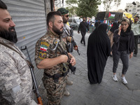 The Islamic Revolutionary Guard Corps (IRGC) armed special forces are monitoring an area during a funeral ceremony for Hamas leader Ismail H...