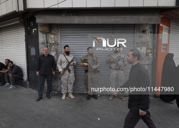 The Islamic Revolutionary Guard Corps (IRGC) armed special forces are monitoring an area during a funeral ceremony for Hamas leader Ismail H...