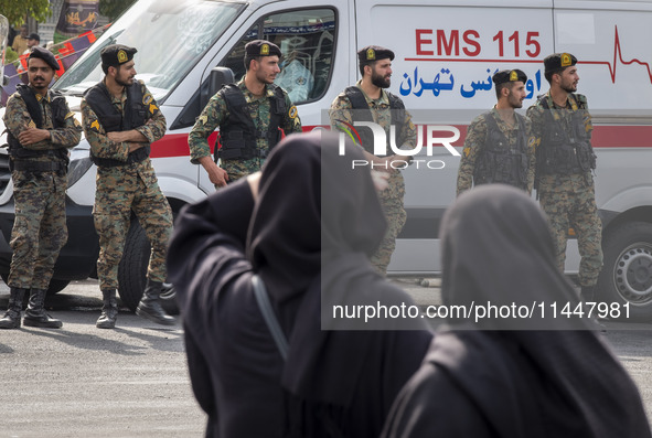 Iranian special police forces are monitoring an area during a funeral ceremony for Hamas leader Ismail Haniyeh and his bodyguard Abu Shaaban...